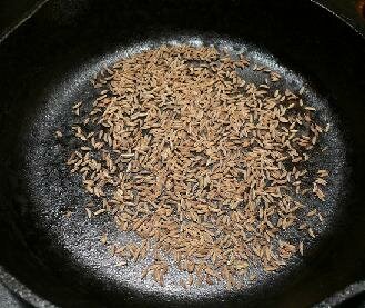 Toasting caraway seeds for harissa